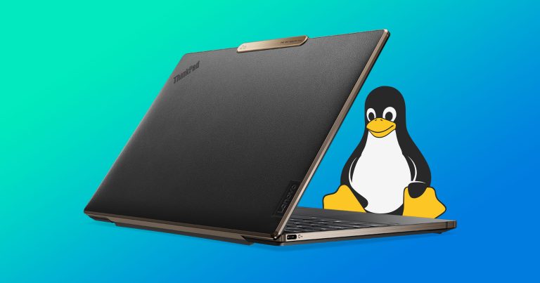 Lenovo thinkpad with the linux mascot sat behind it
